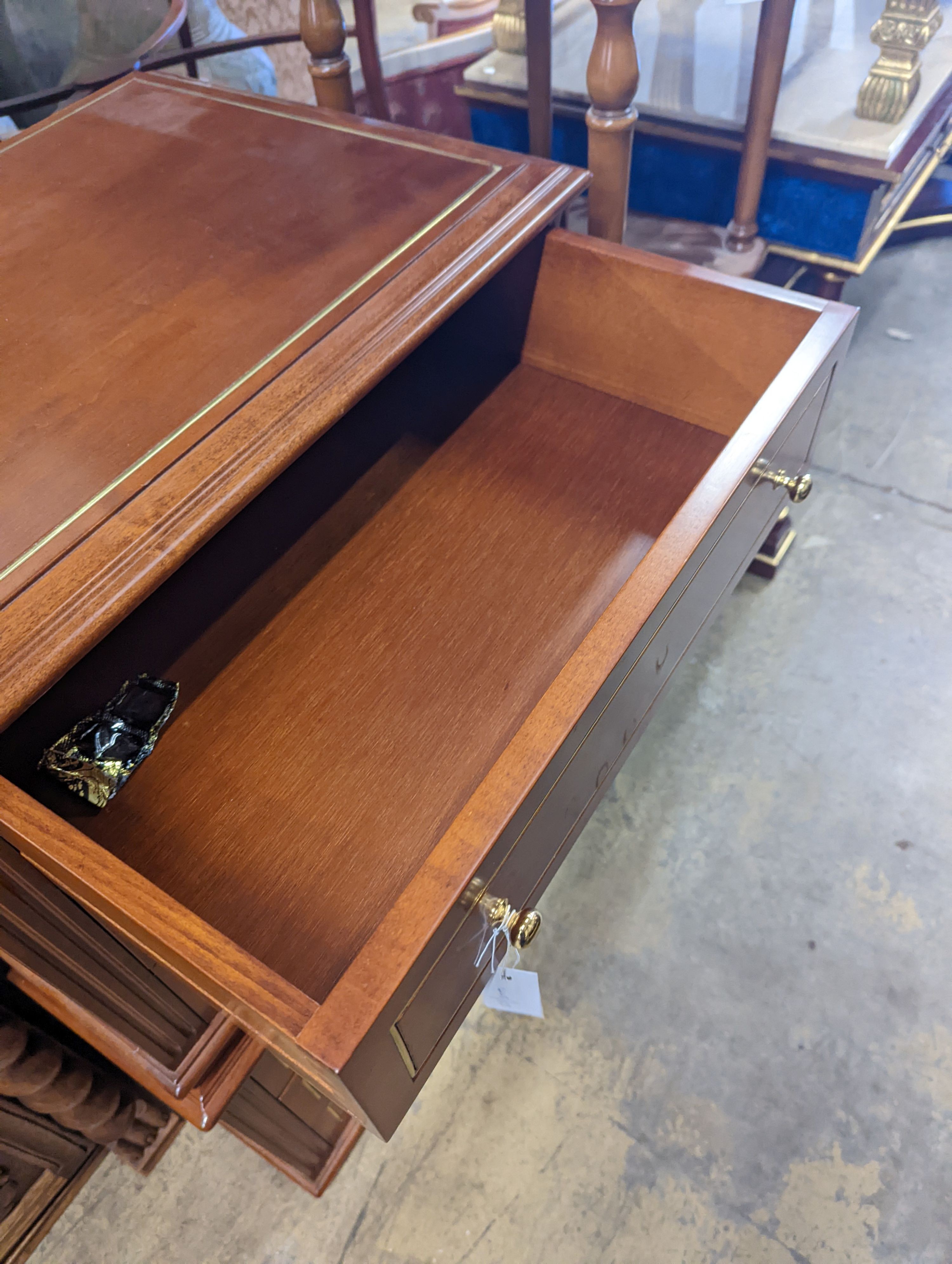 A pair of contemporary brass inlaid cherry bedside chests, width 65cm, depth 45cm, height 50cm